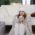 Woman feeling cold and low-energy, struggling with winter blues and seasonal depression